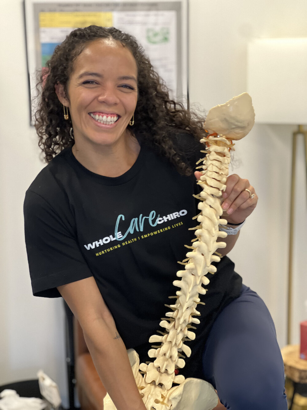 Member education on spinal health and subluxation at WholeCare Wellness Collective Marietta